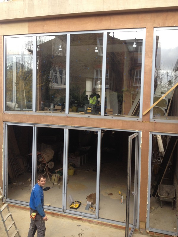 Aluminium bi-fold doors with two-storey glazing in Upper Edmonton