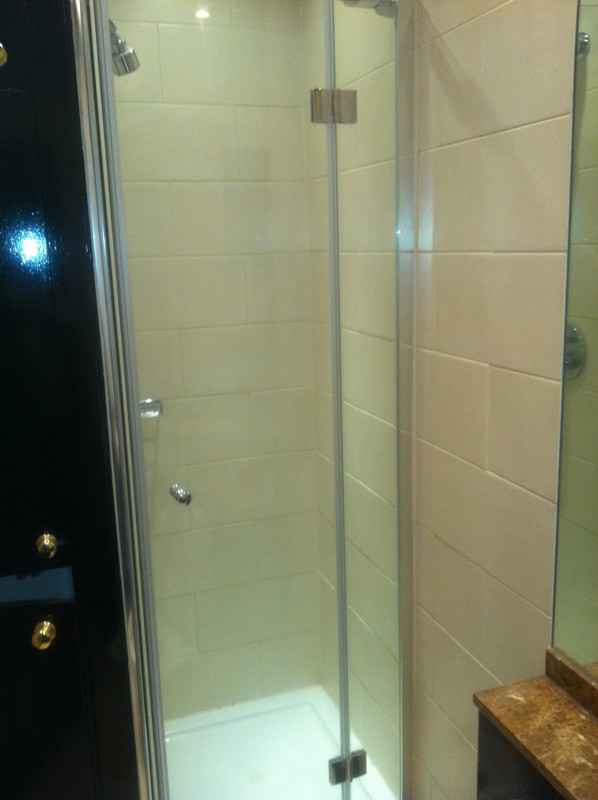 Frameless glass shower enclosure with chrome fittings in Upper Edmonton
