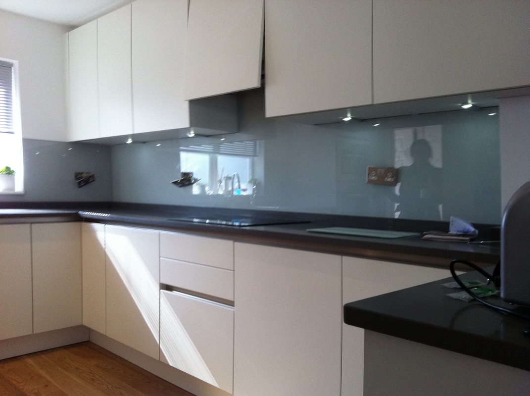 Grey glass kitchen splashback with LED lighting in Upper Edmonton