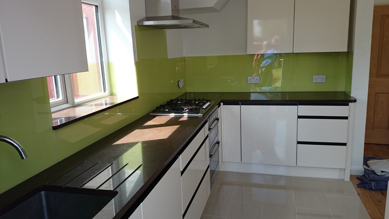 Lime green glass kitchen splashback installed by Upper Edmonton glaziers