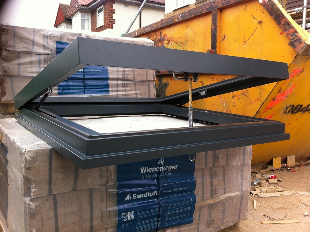 Opening flat roof skylight in anthracite grey installed in Upper Edmonton