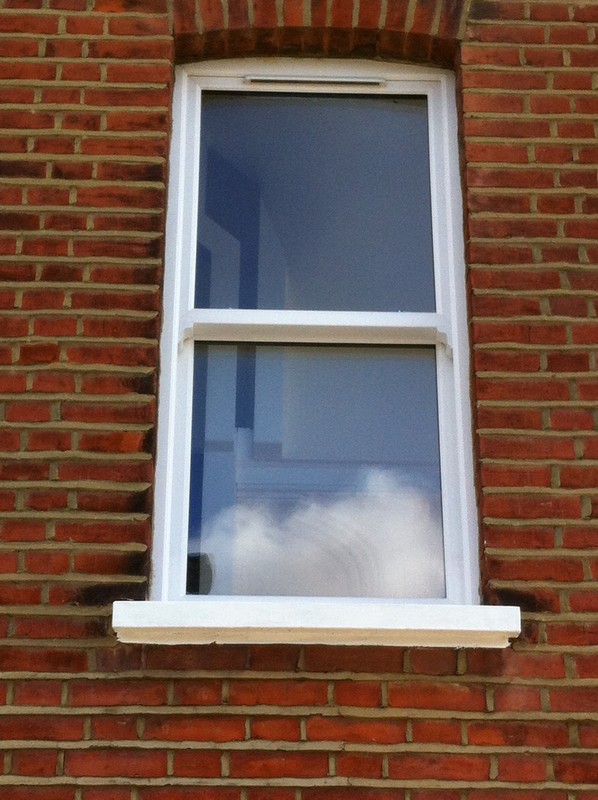 uPVC sash window on Victorian red brick house in Upper Edmonton